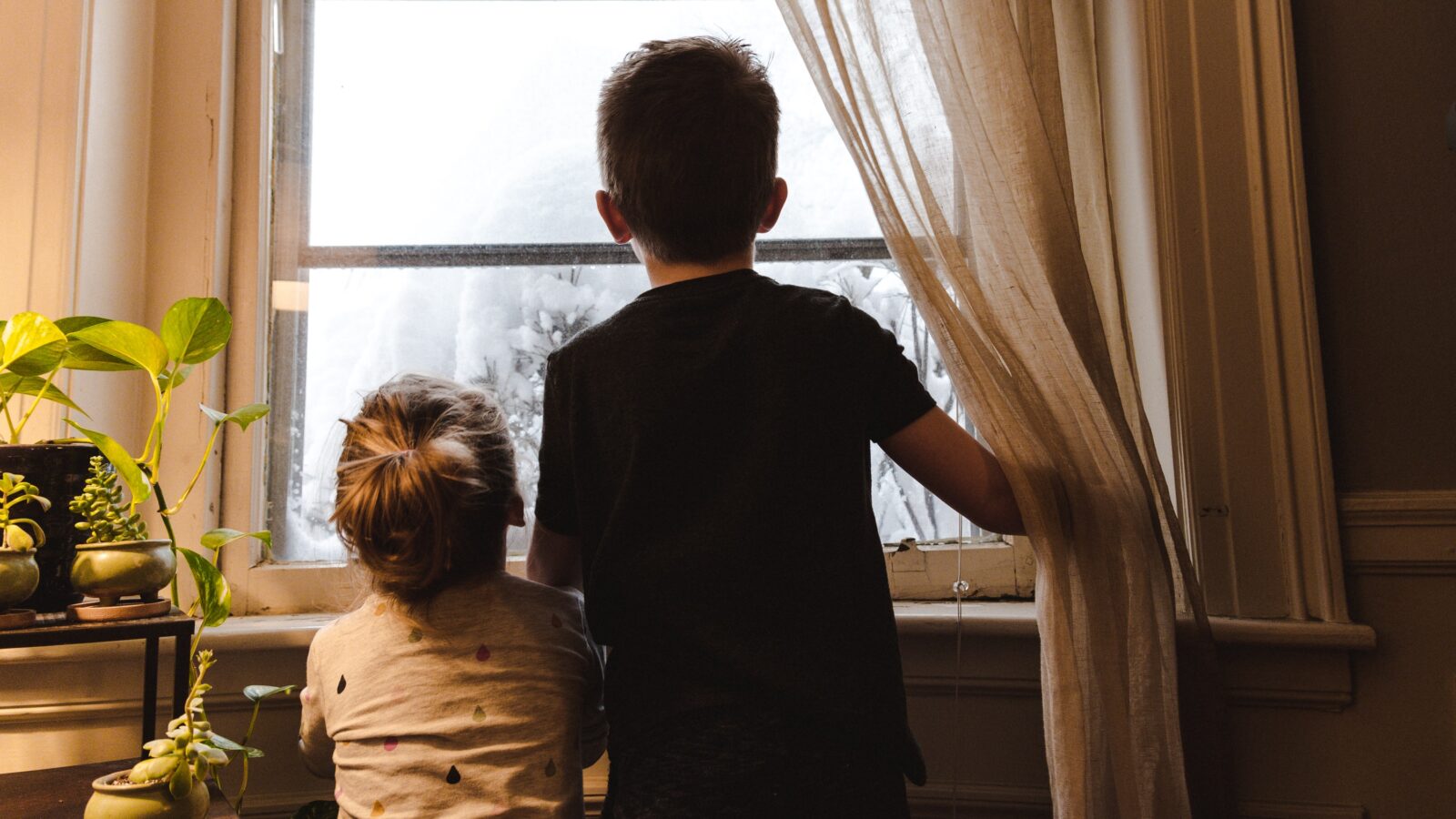 Children in window representing child support in a divorce