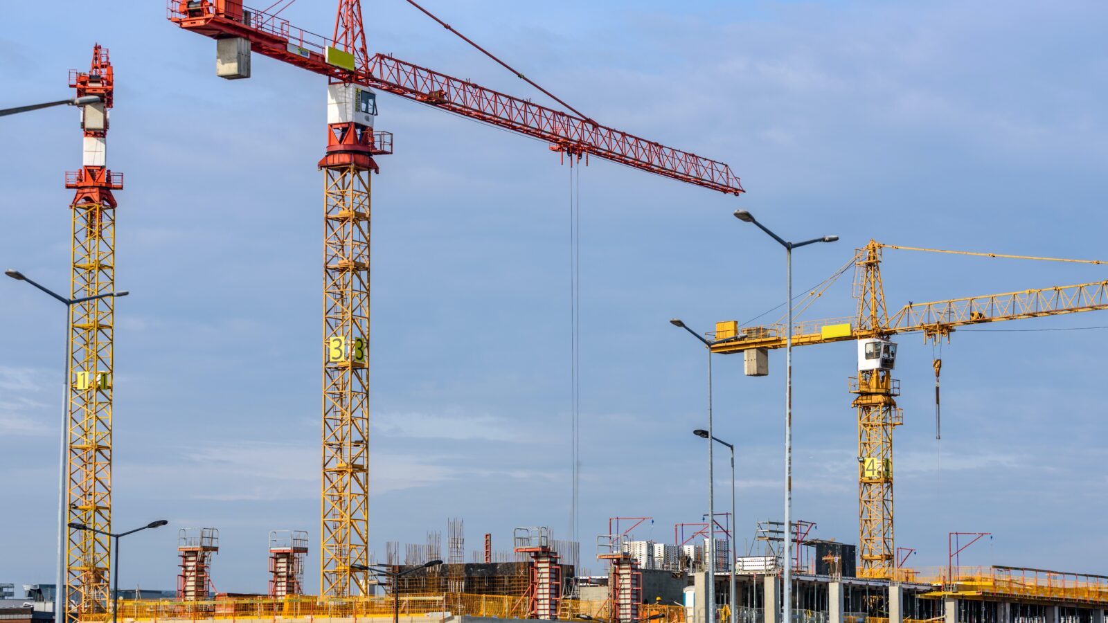 Tower cranes representing new Alberta Legislation on Construction Liens